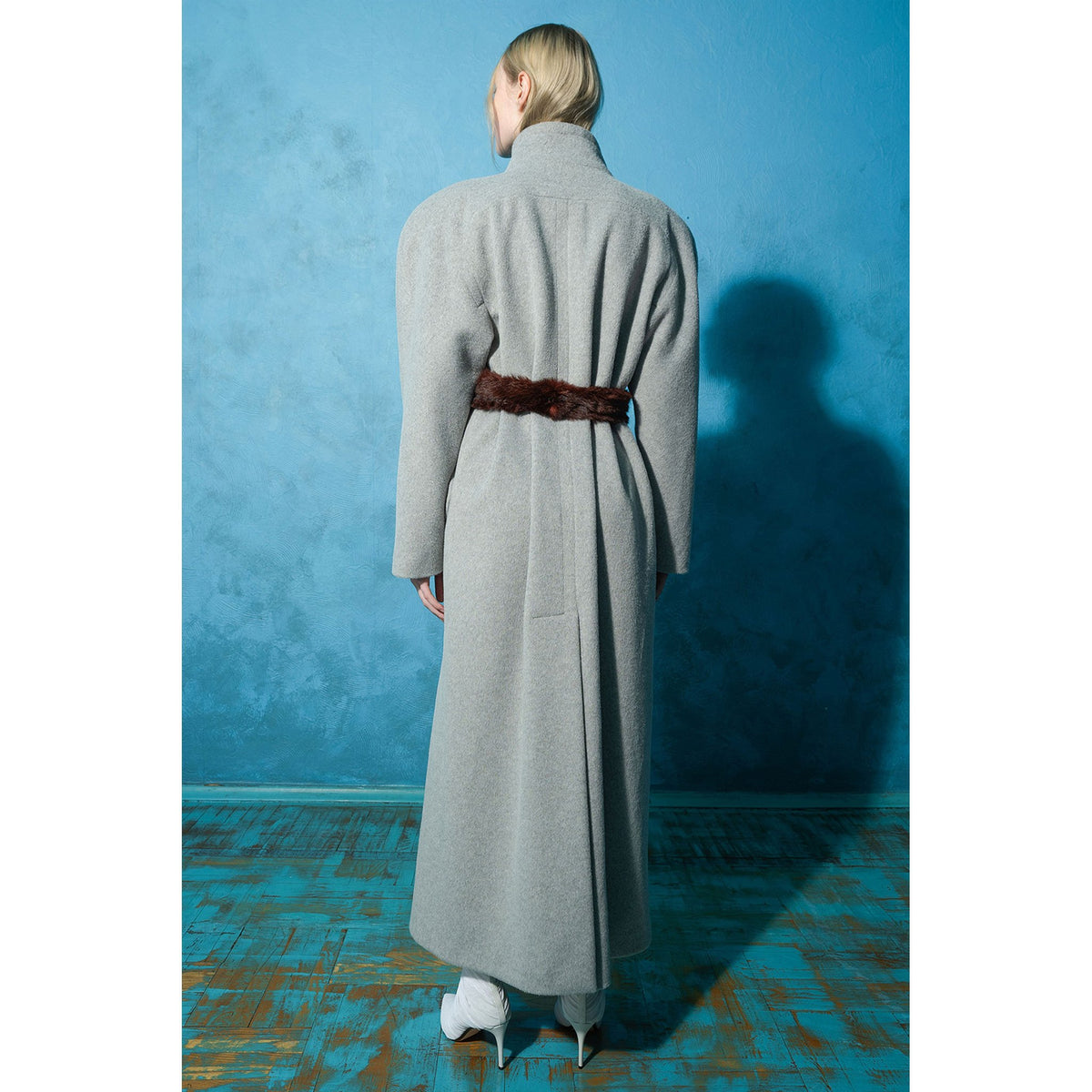 Model wearing grey wool-blend maxi coat with vintage buttons by MASHAT