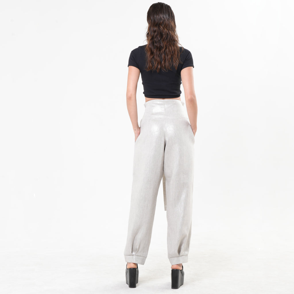 High-waisted silver linen pants by METAMORPHOZA with a paper bag waist and relaxed tapered leg. Lightweight and limited edition. L High-waisted silver linen pants by METAMORPHOZA with a paper bag waist and relaxed tapered leg. Lightweight and limited edition. L