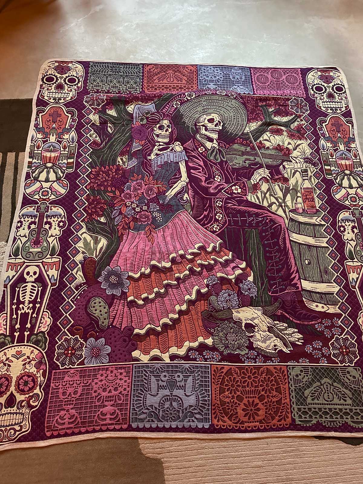 STUDIO WUNDERBAR Dia Del Muerto Coat: purple floral patchwork long coat with a magenta panel, botanical and geometric prints and skull tapestry details, upcycled one-of-a-kind coat, close-up detail, buy at DOORS NYC