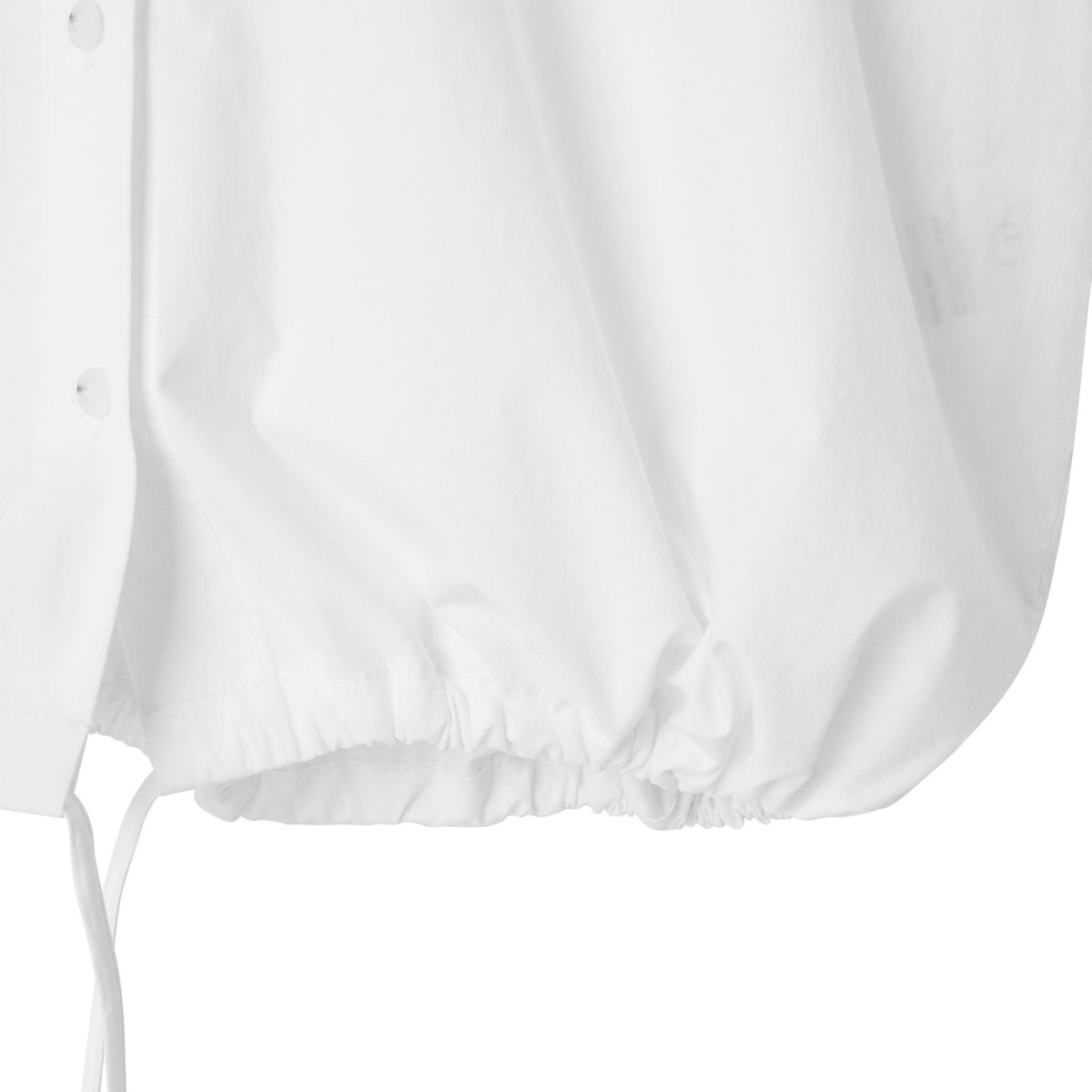 White blouse with balloon sleeves on a light gray background