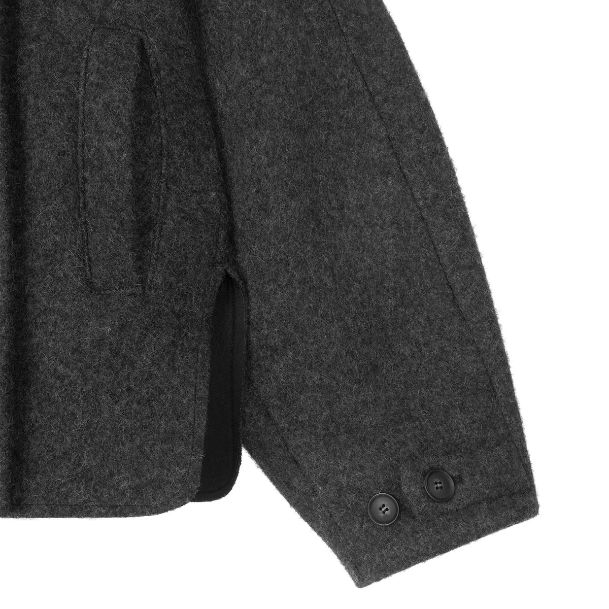 Close-up of a gray coat sleeve with buttons on a white background