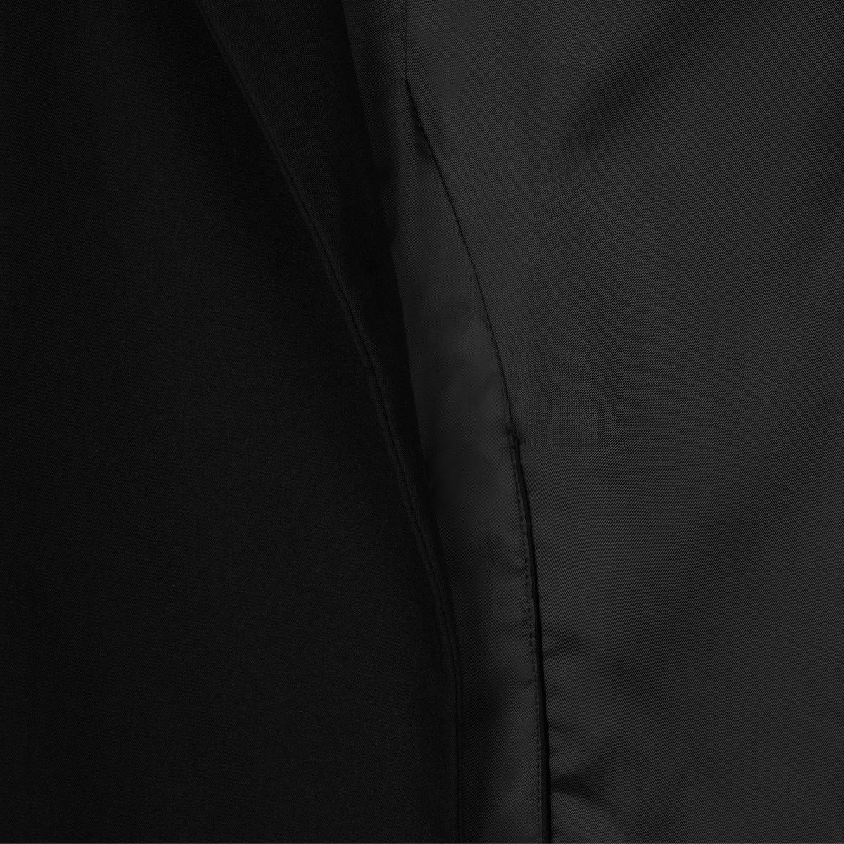 Close-up of a black jacket with a focus on the fabric texture.
