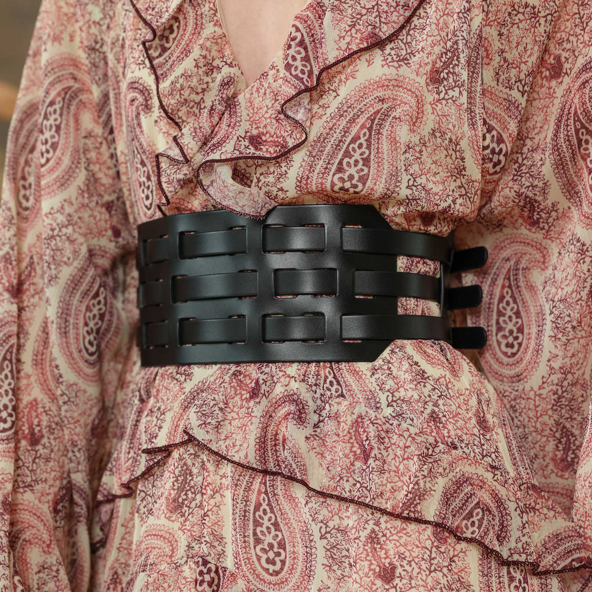 Patterned dress with a black woven belt