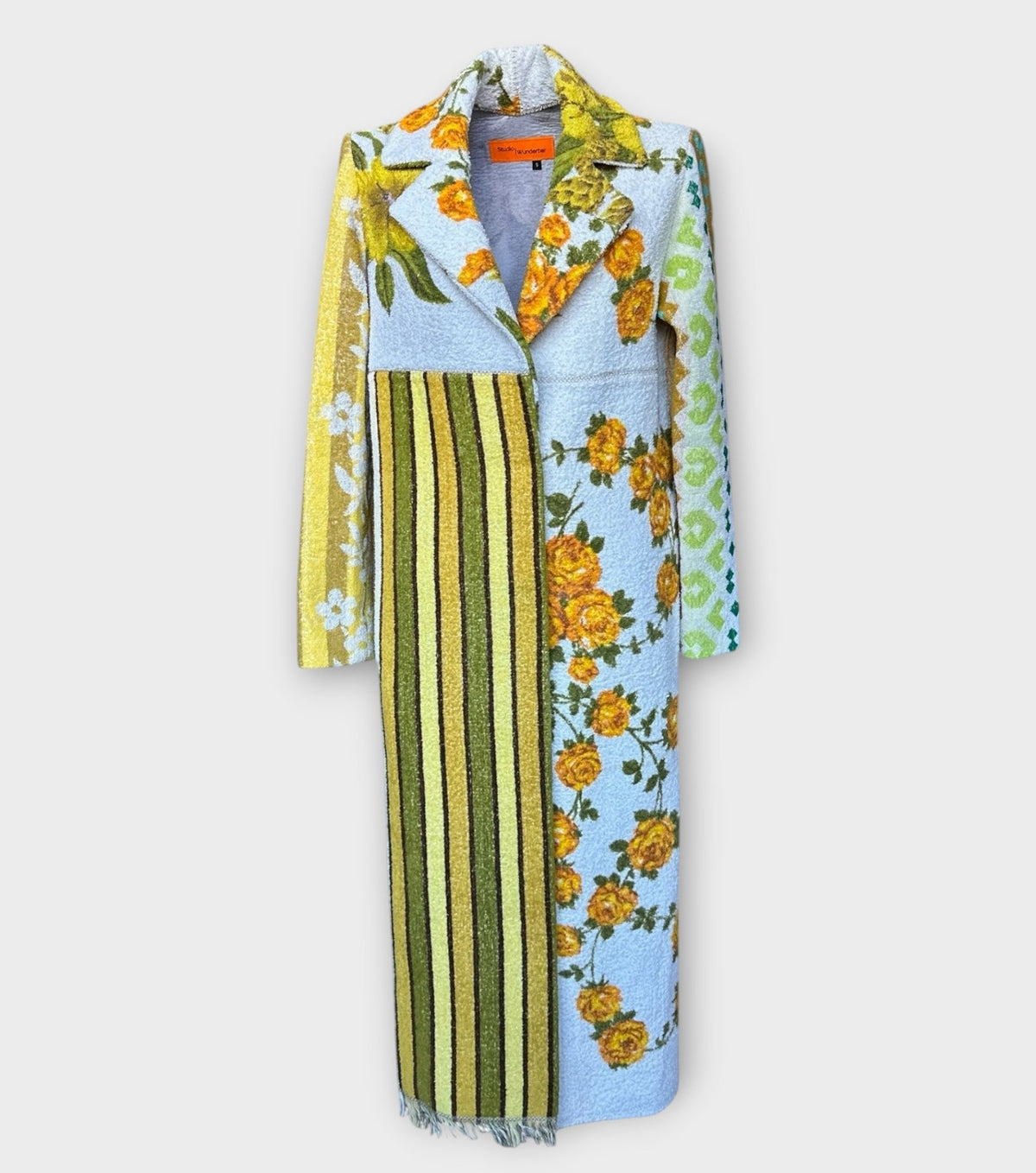 STUDIO WUNDERBAR Hella Horse Coat: blue floral patchwork long coat with yellow roses, striped panels, fringe hem and a horse panel on the back, upcycled one-of-a-kind coat, alternate angle, buy at DOORS NYC
