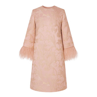 Powder pink brocade mini dress with feather sleeve trim.