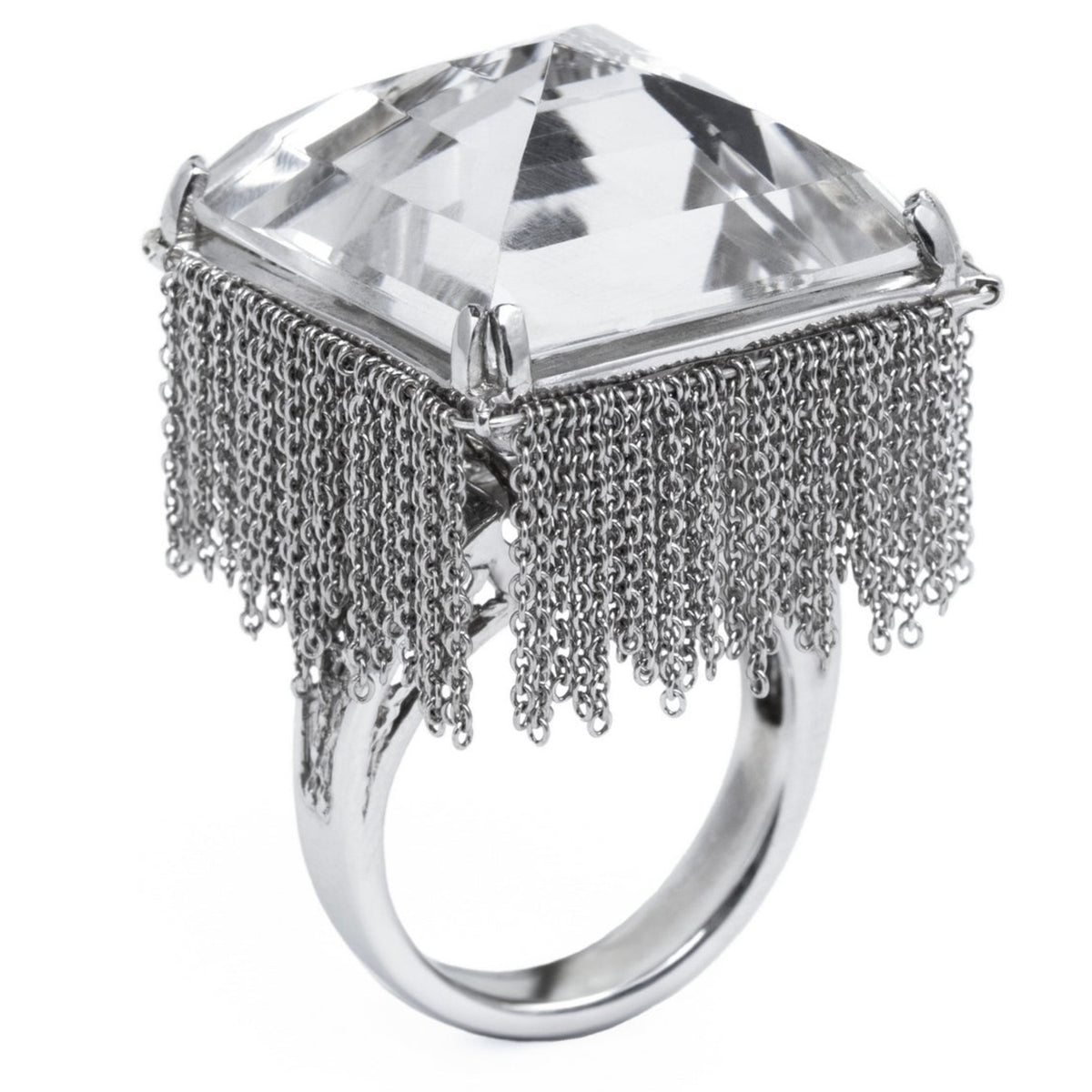 Ring with a large clear gemstone and silver fringe details on a white background