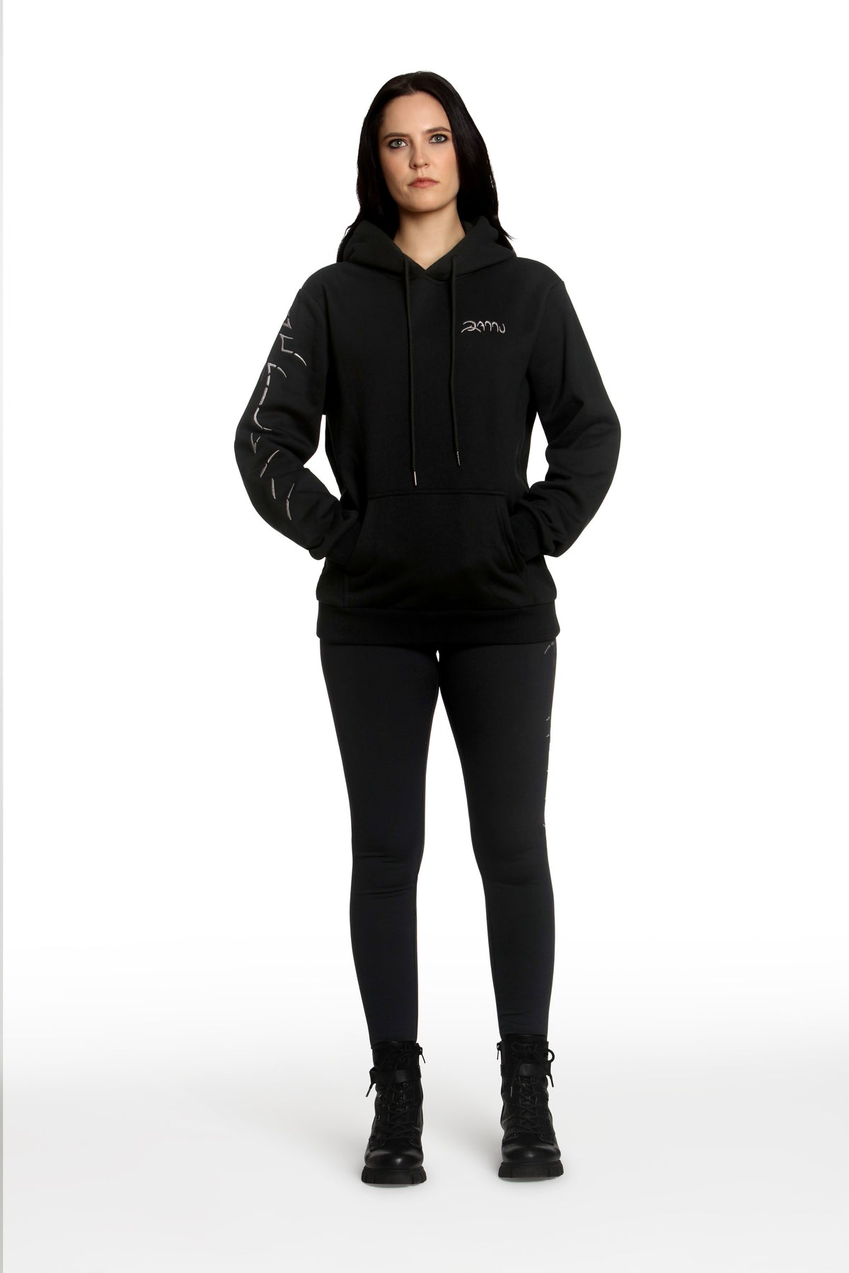 Person wearing a black hoodie with a brand logo on a white background