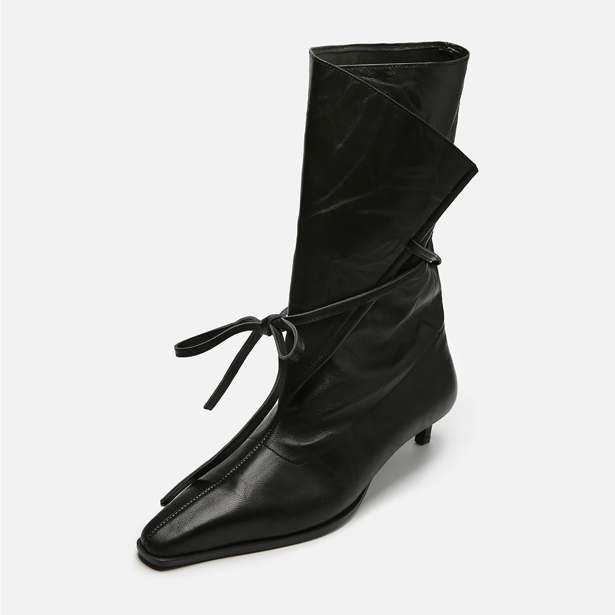 THEN’s Black Folded-Top Leather Ankle Boots with Wraparound Tie are handcrafted in Korea, featuring an asymmetrical shaft, pointed toe, kitten heel, and a modern angular folded-over top for an unconventional look.