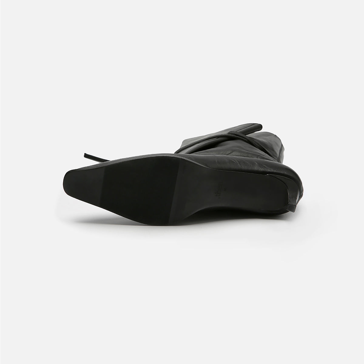 The THEN Black Folded-Top Leather Ankle Boots with Wraparound Tie are shown on their side against a white background, highlighting the smooth sole and pointed toe—an elegant handcrafted minimalist design from Korea.