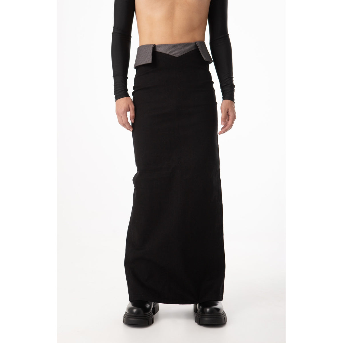 Person wearing a long black garment on a white background