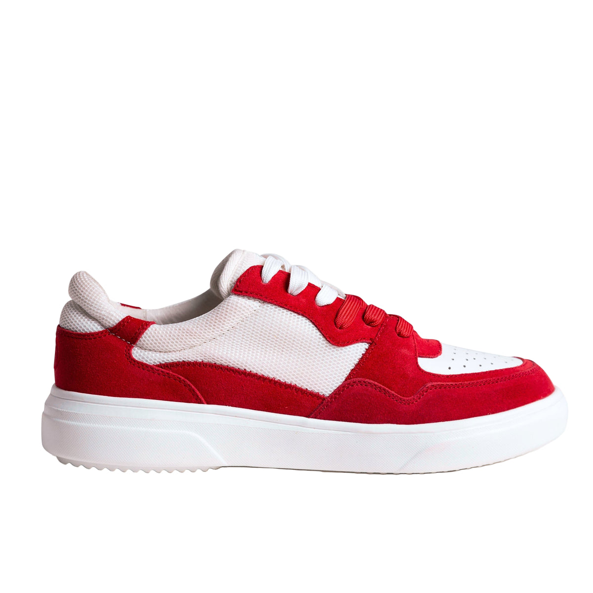 Red and white sneaker on a light gray background