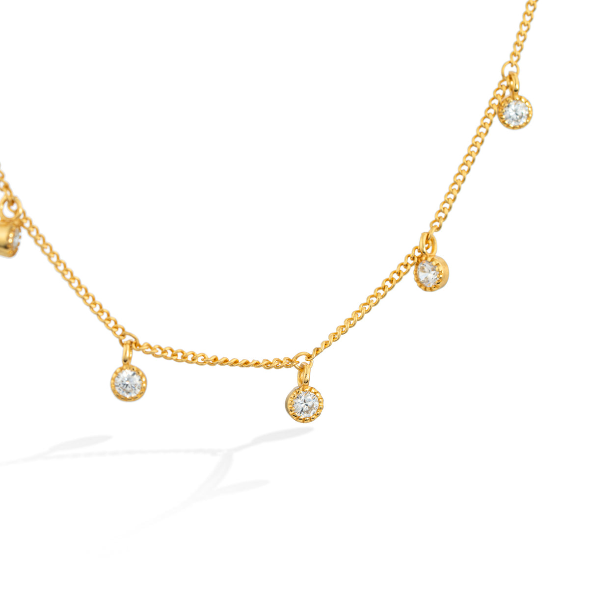 Gold Starry Charm Necklace with Zirconia Accents