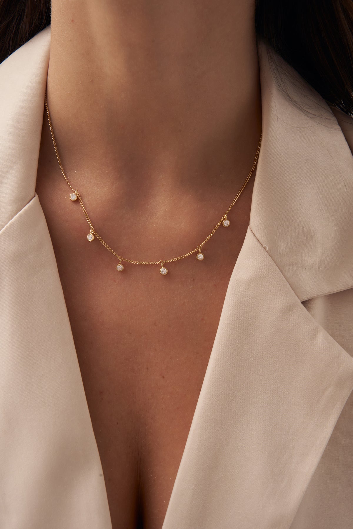 Gold Starry Charm Necklace with Zirconia Accents