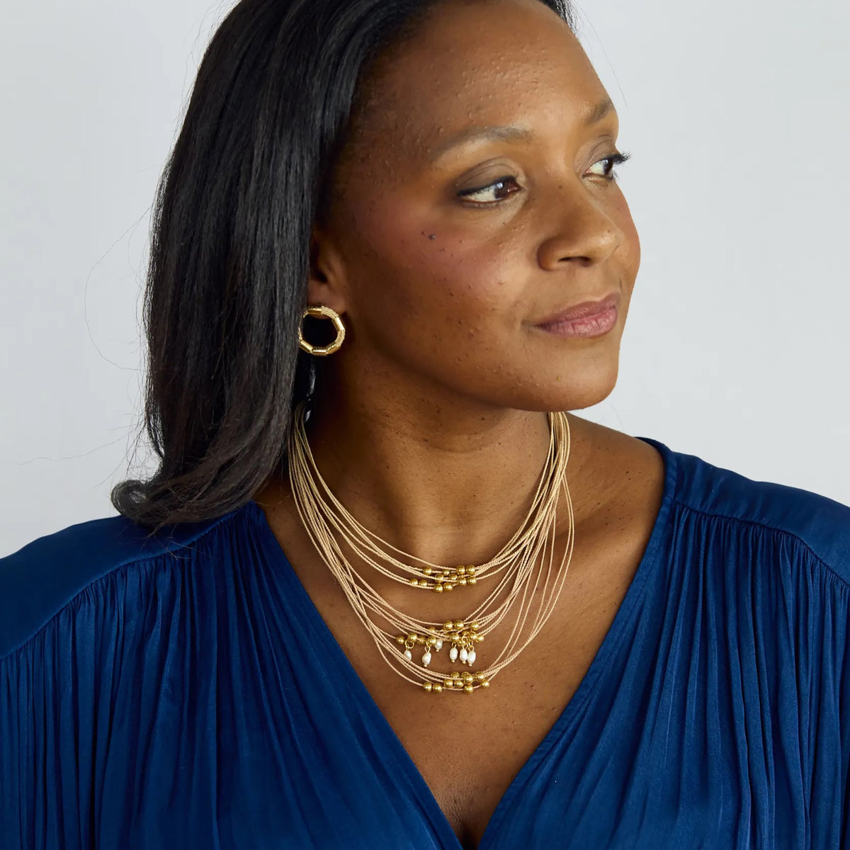 NART balls layers buriti necklace worn by model, women's artisan necklace, buy at DOORS NYC