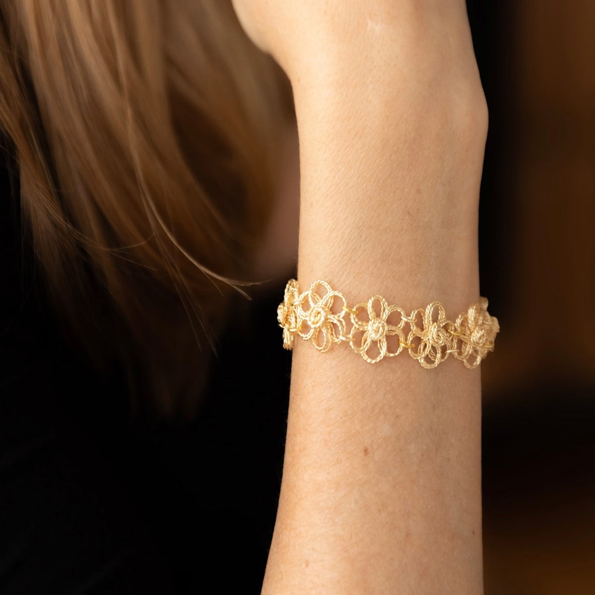 NART daisy bracelet close-up on model, buy at DOORS NYC