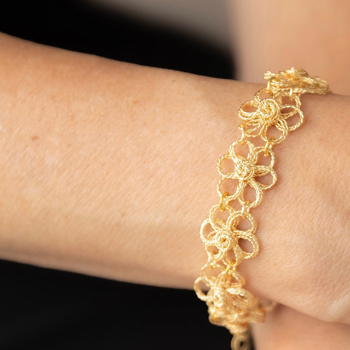NART daisy bracelet styled look on wrist, buy at DOORS NYC