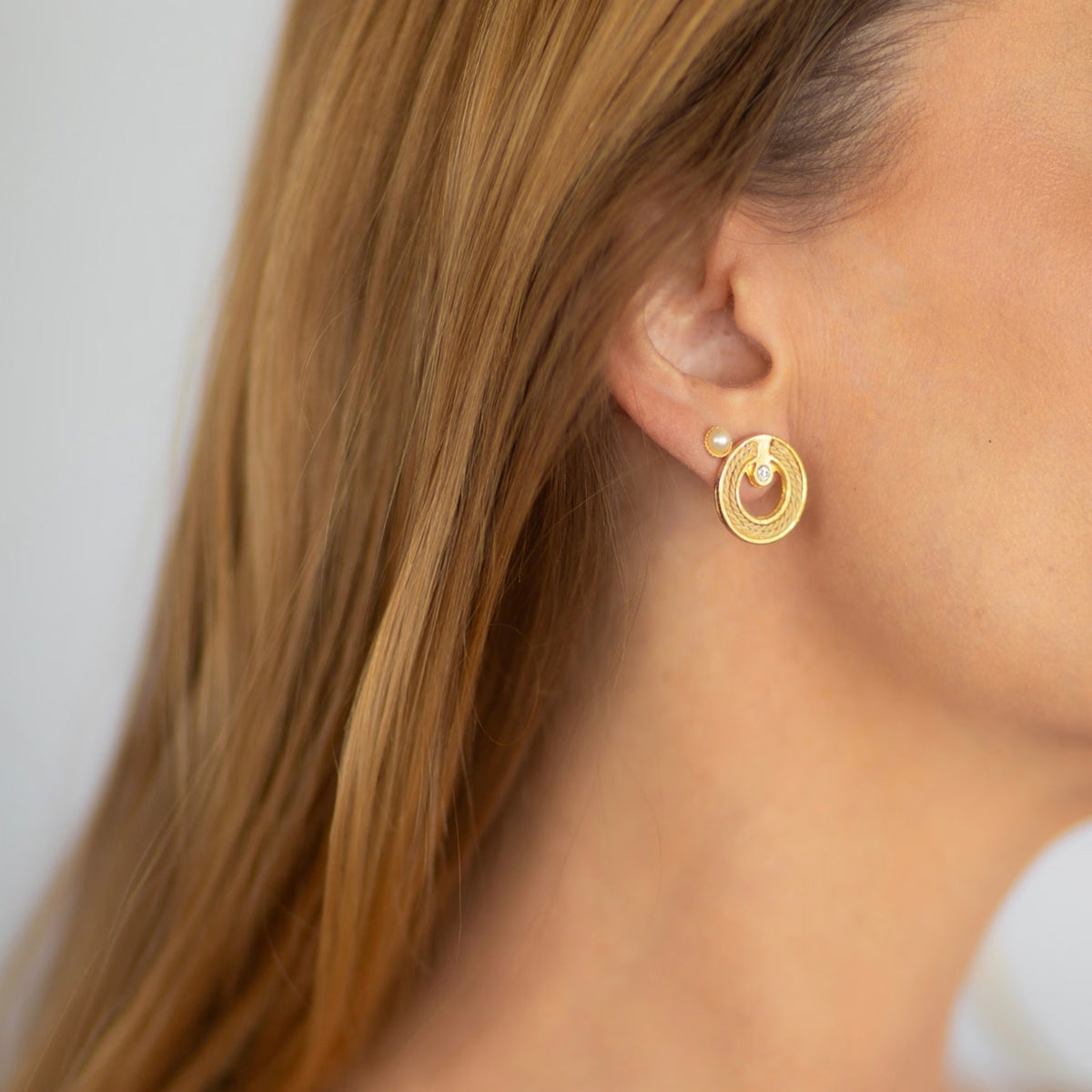 NART dot in a circle buriti earrings worn by model, women's artisan earrings, buy at DOORS NYC