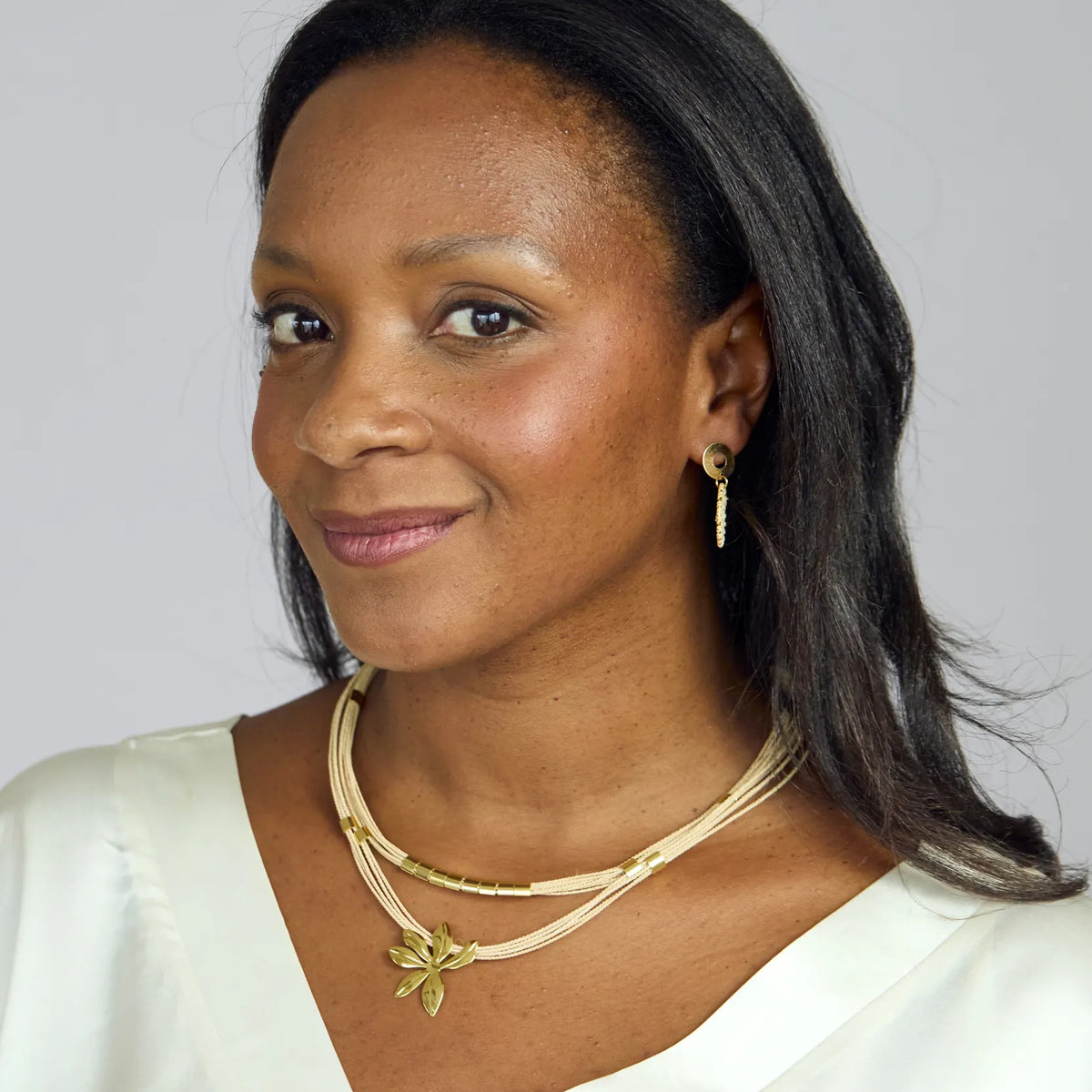 NART flower buriti fiber necklace worn by model, women's artisan necklace, buy at DOORS NYC