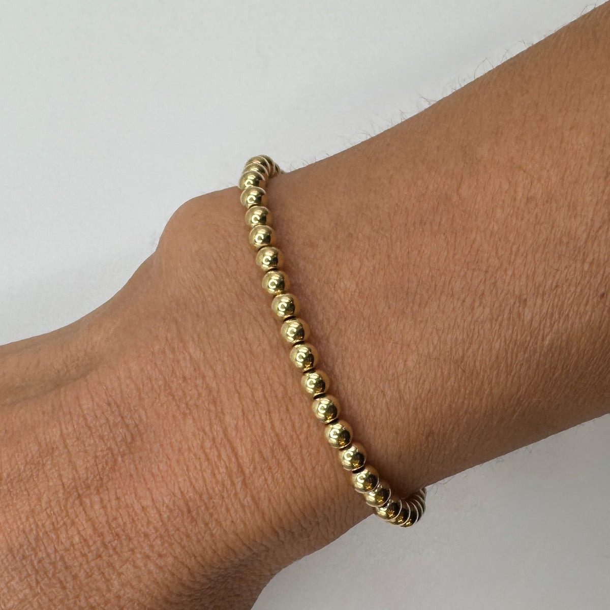 NART gold stackable bracelet 6mm styled look on wrist, women's gold-plated bracelet, buy at DOORS NYC