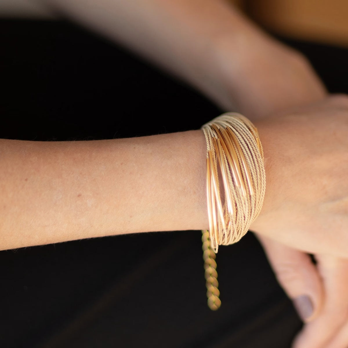 NART multiple buriti fiber bracelet close-up on wrist, handmade women's bracelet, buy at DOORS NYC