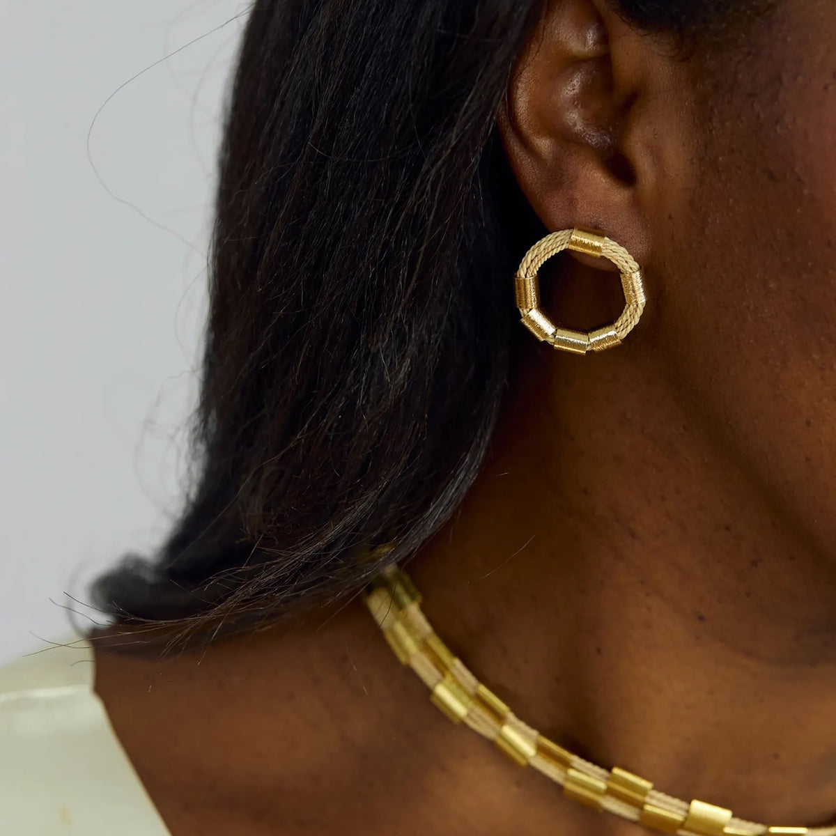 NART rings buriti fiber earrings close-up on model, handmade women's earrings, buy at DOORS NYC