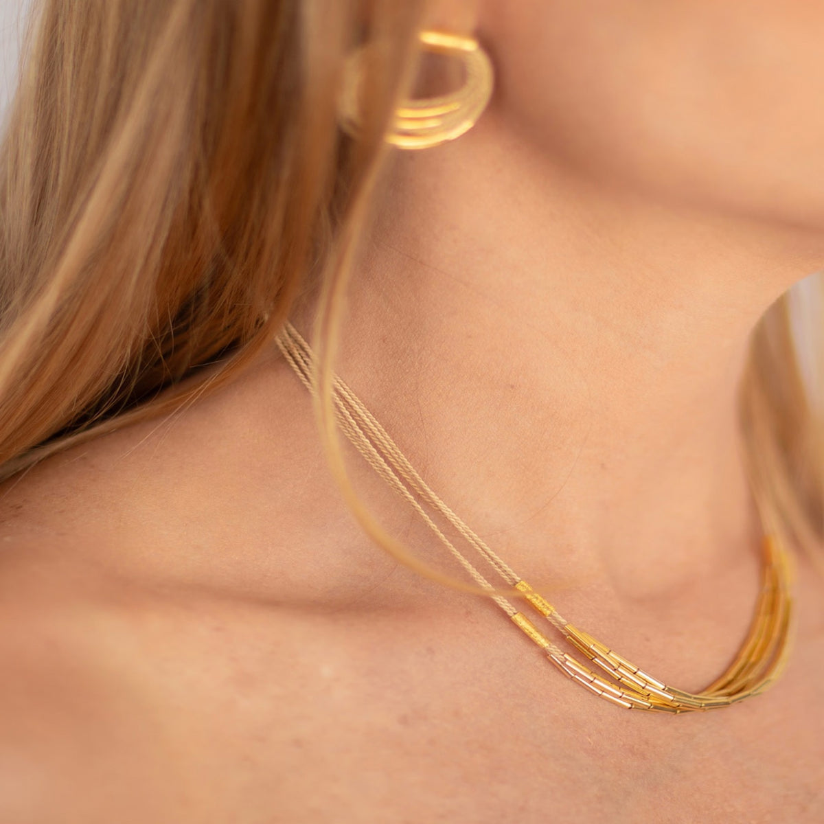 NART single buriti necklace close-up on model, buy at DOORS NYC