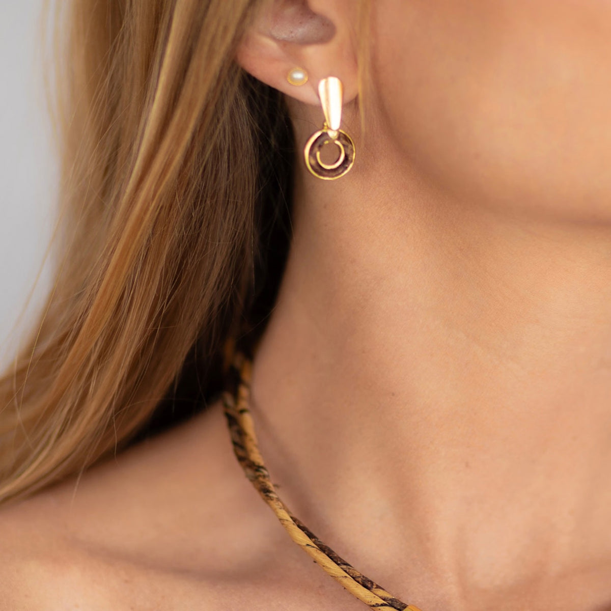 NART single round banana fiber earrings worn by model, women's artisan earrings, buy at DOORS NYC