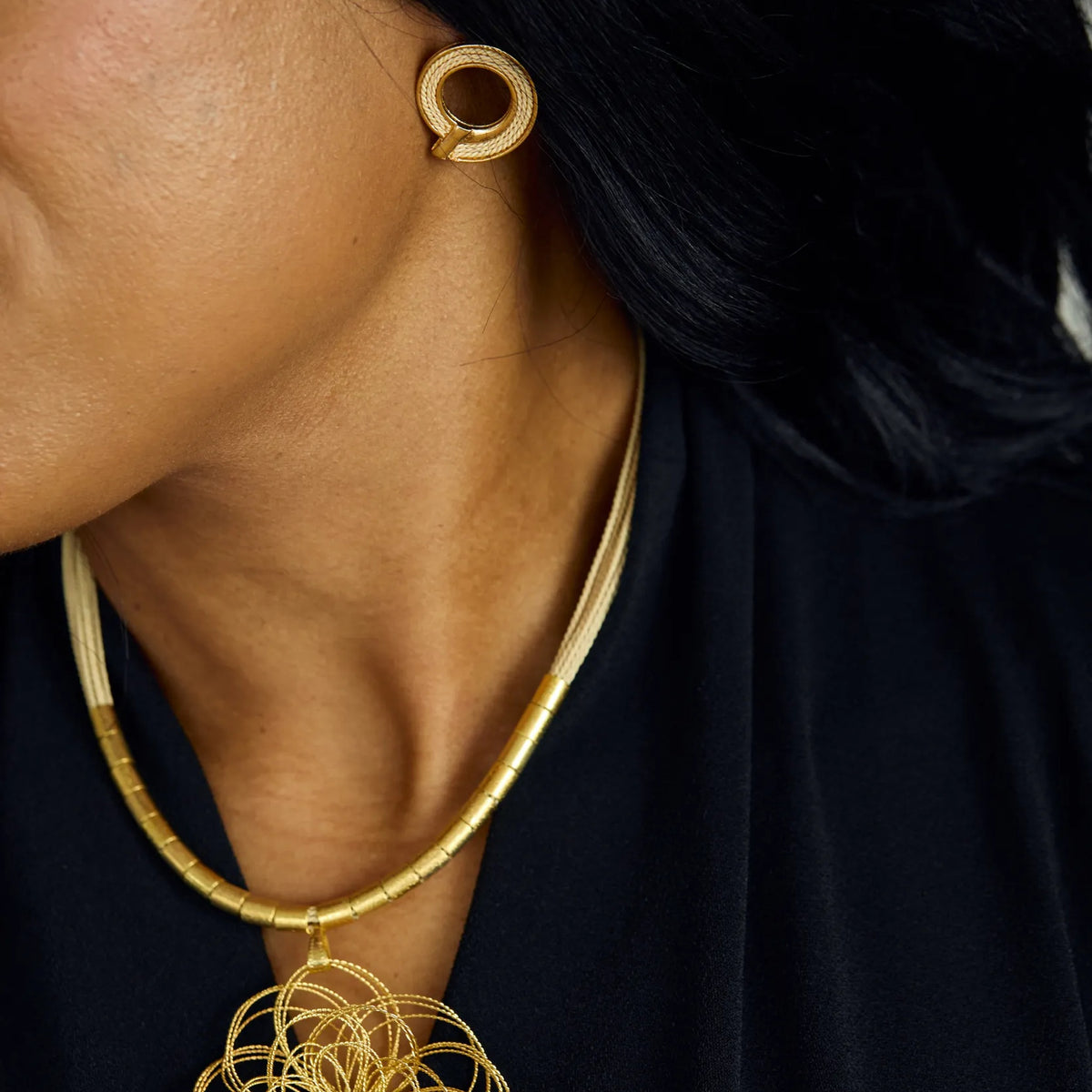 NART spiral buriti fiber earrings worn by model, women's artisan earrings, buy at DOORS NYC