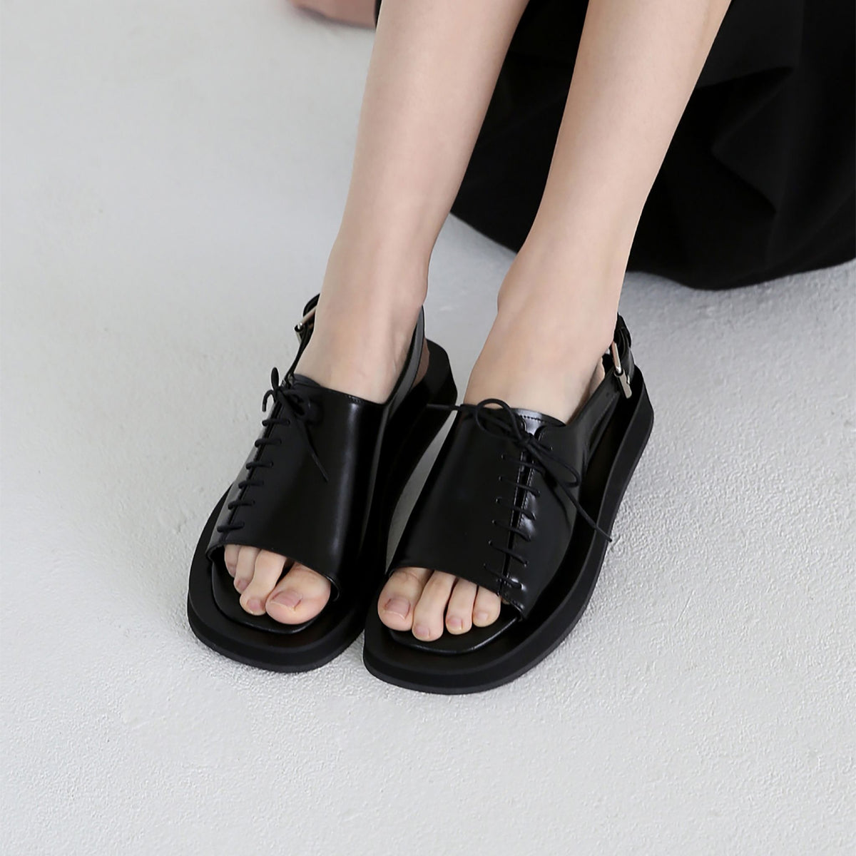 Black Leather Lace‑
Front Slingback Sandals