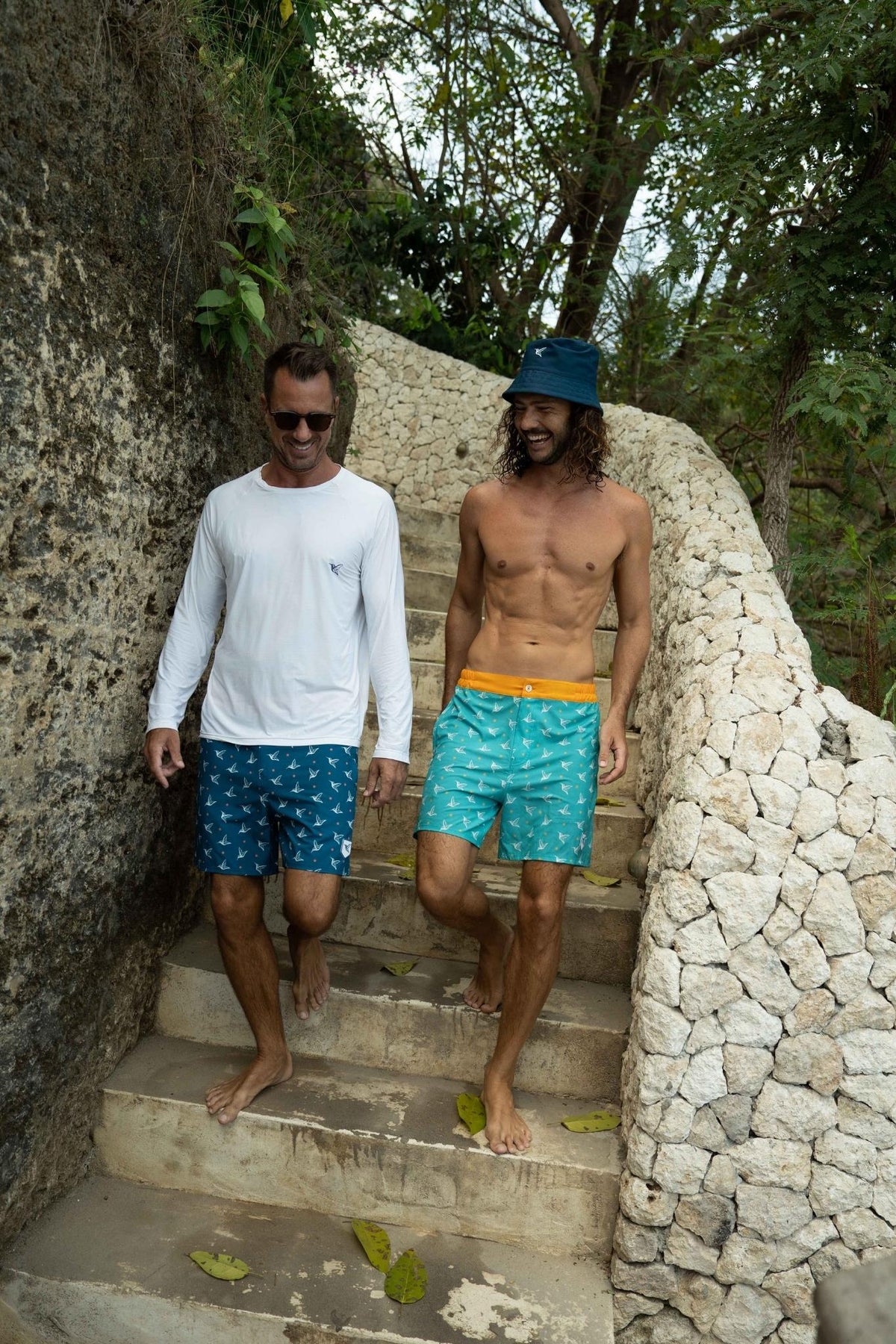 Model wearing white UPF long sleeve activity shirt outdoors