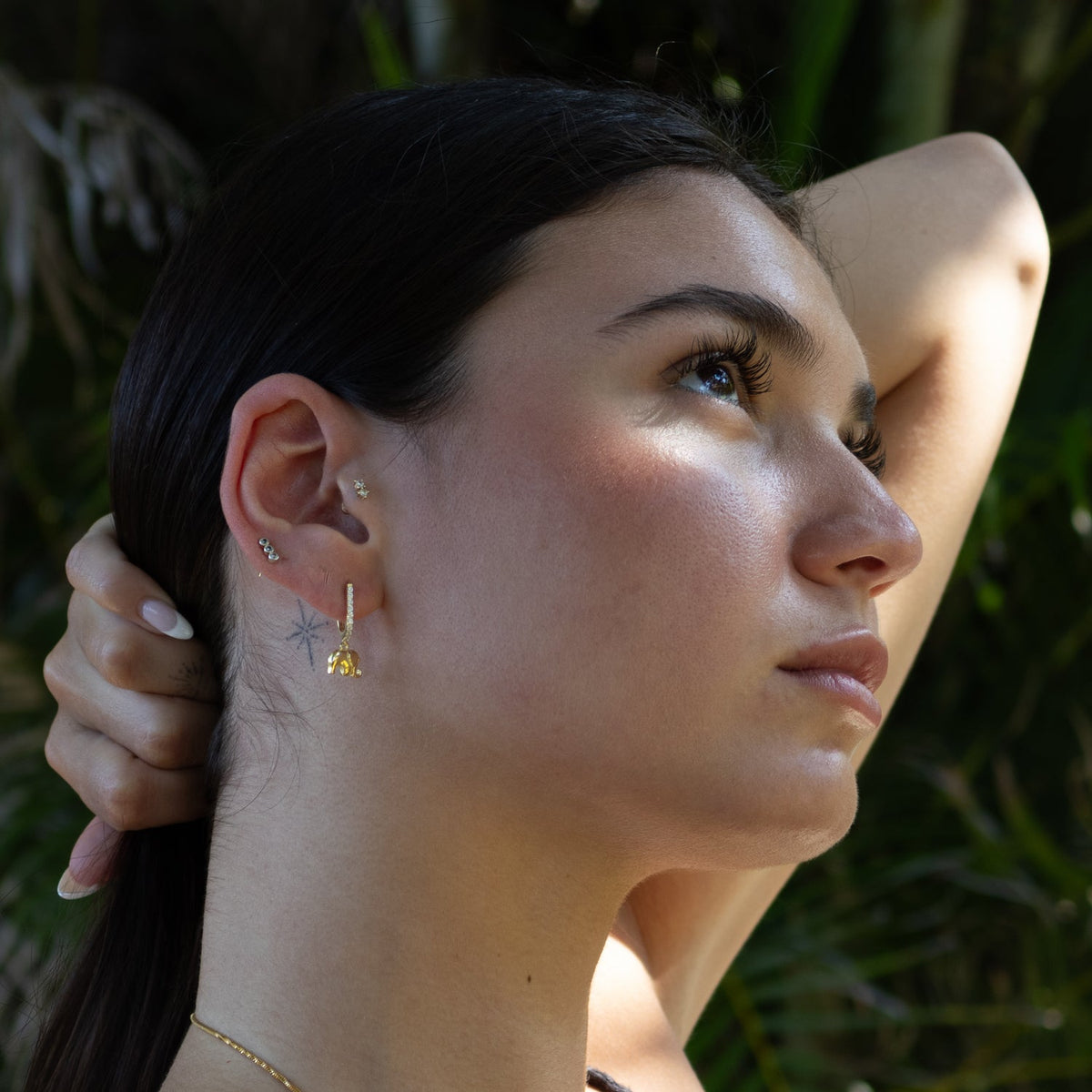 Spiritual charm earrings crafted in gold and designed for balance and positivity

