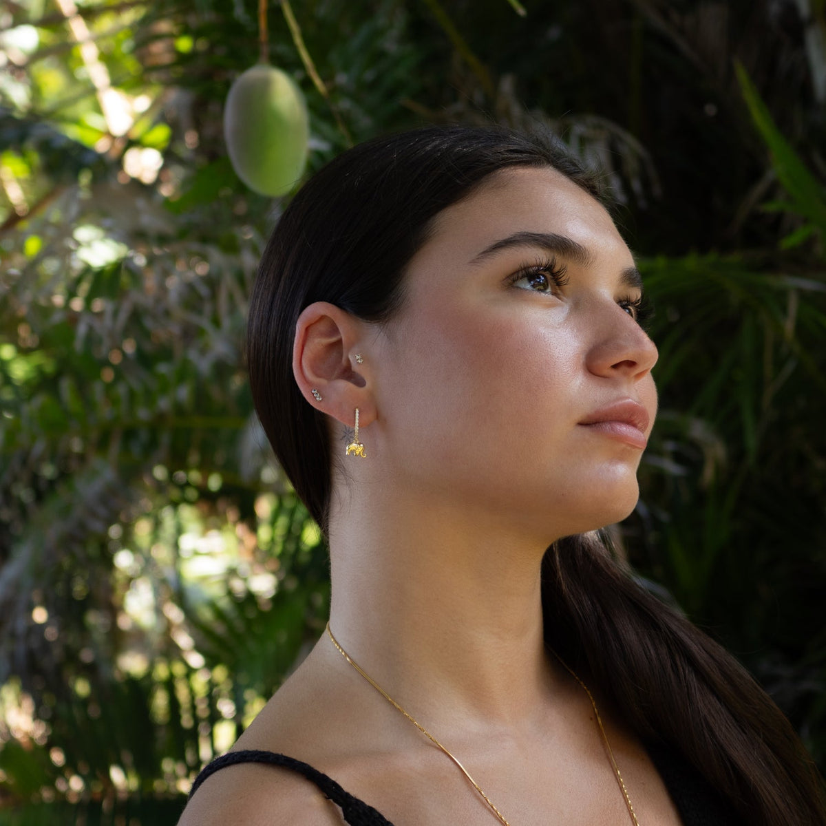 Petite hoop earrings with CZ diamond accents and gold elephant totem design

