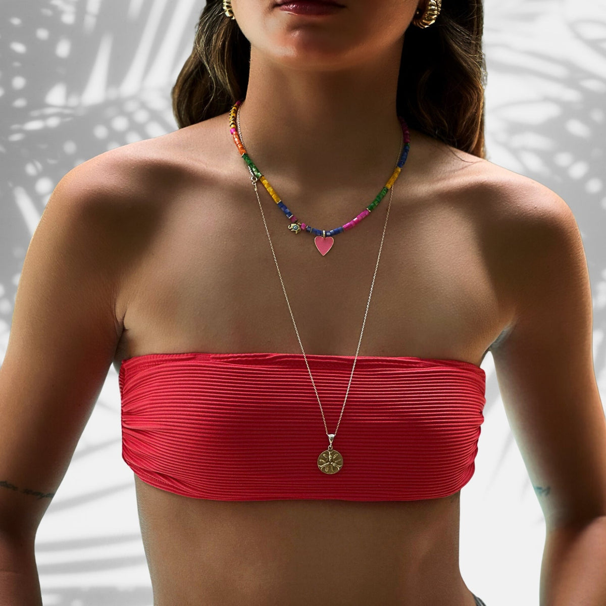 Elegant necklace with multicolor pearl beads, an 18K gold-plated pink heart pendant, and a gold elephant charm