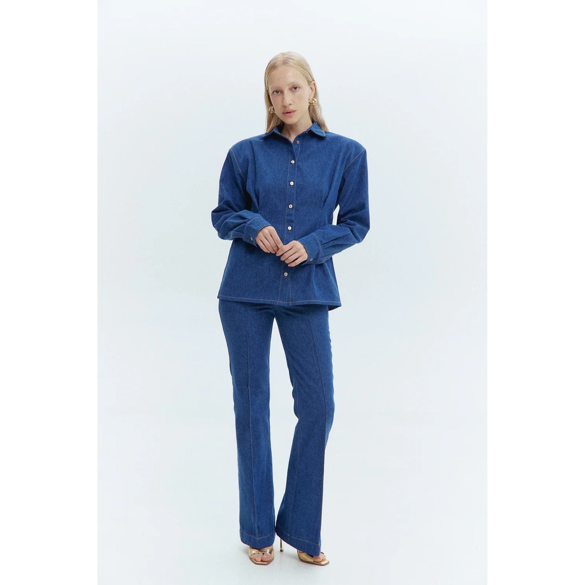 Woman wearing a blue outfit on a white background