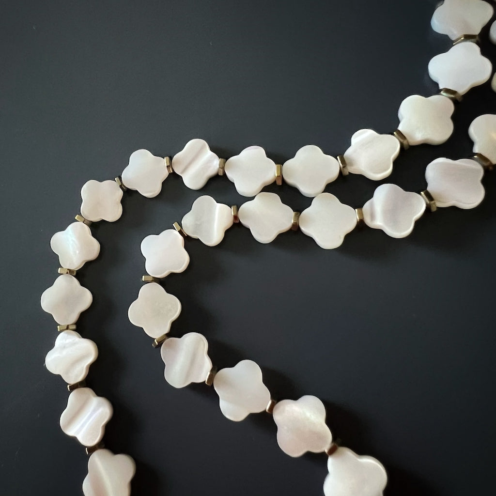 Unique Pearl Clover Necklace with gold hematite spacers and protective Evil Eye pendant.