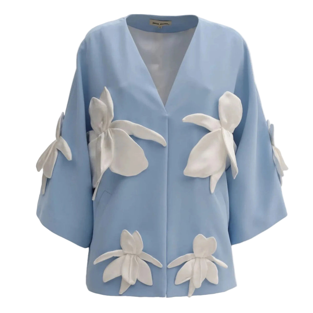 Light blue jacket with white floral embellishments on a light gray background