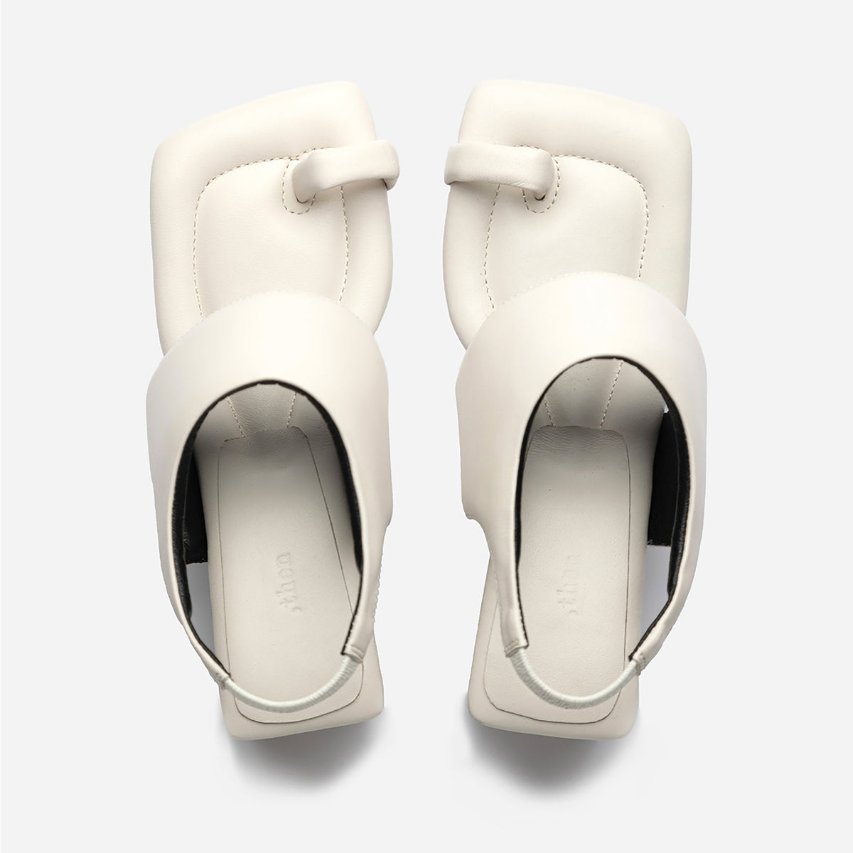 The THEN White Square-Toe Slingback Heeled Sandals feature a modern toe loop and wide strap design, handcrafted in Korea and displayed from above on a light gray background.